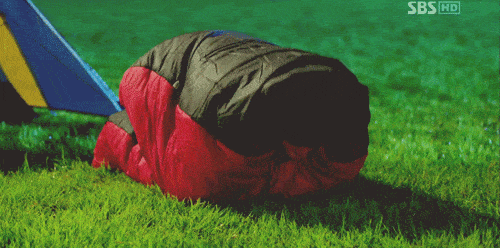 man jumping using sleeping bag