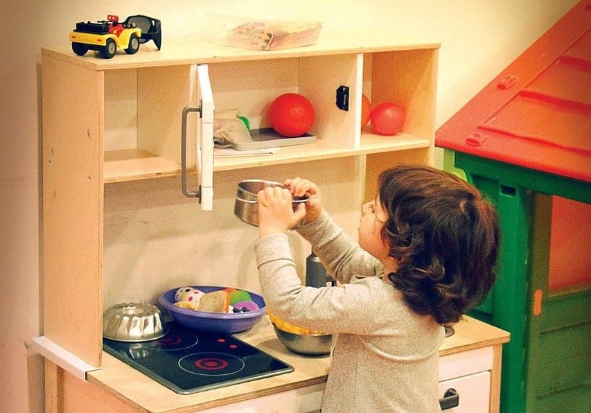 Child Paying her kitchen Toys