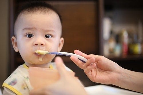 Person feeding baby