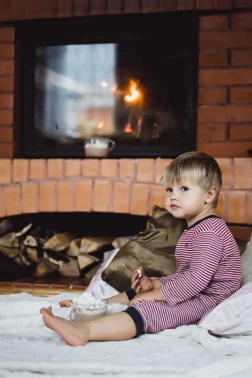 baby near fireplace