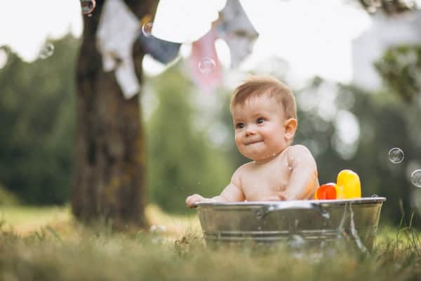 Little toddler boy bathing