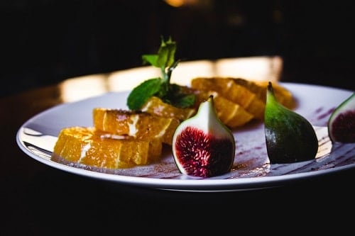 round green fruit on plate