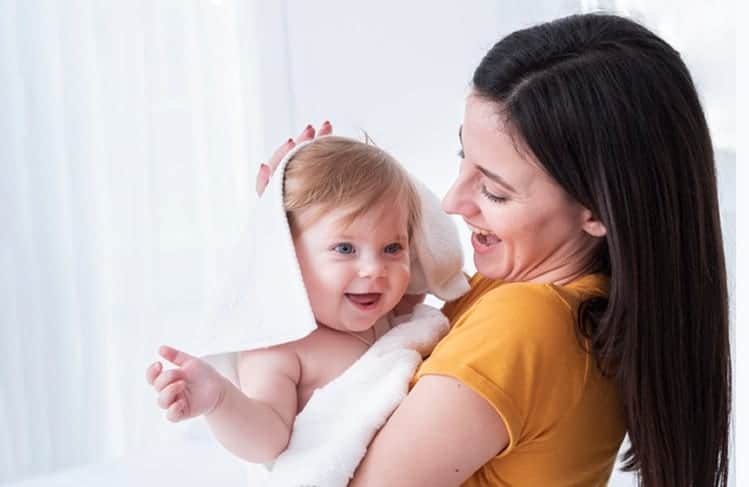 Mom Holding Baby with Towel