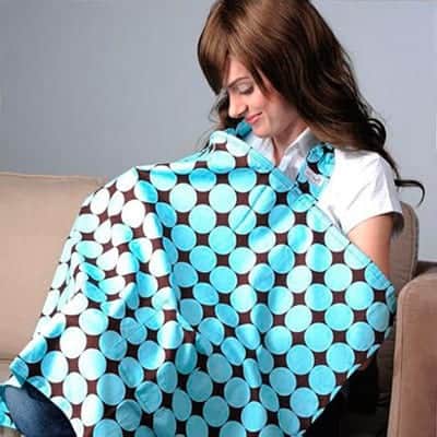 Mother breast feeding with nursing cover hiding baby