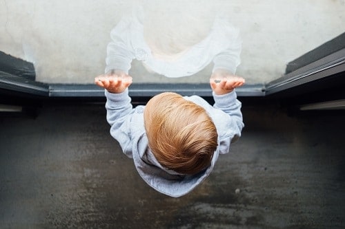 Baby is touching the windows