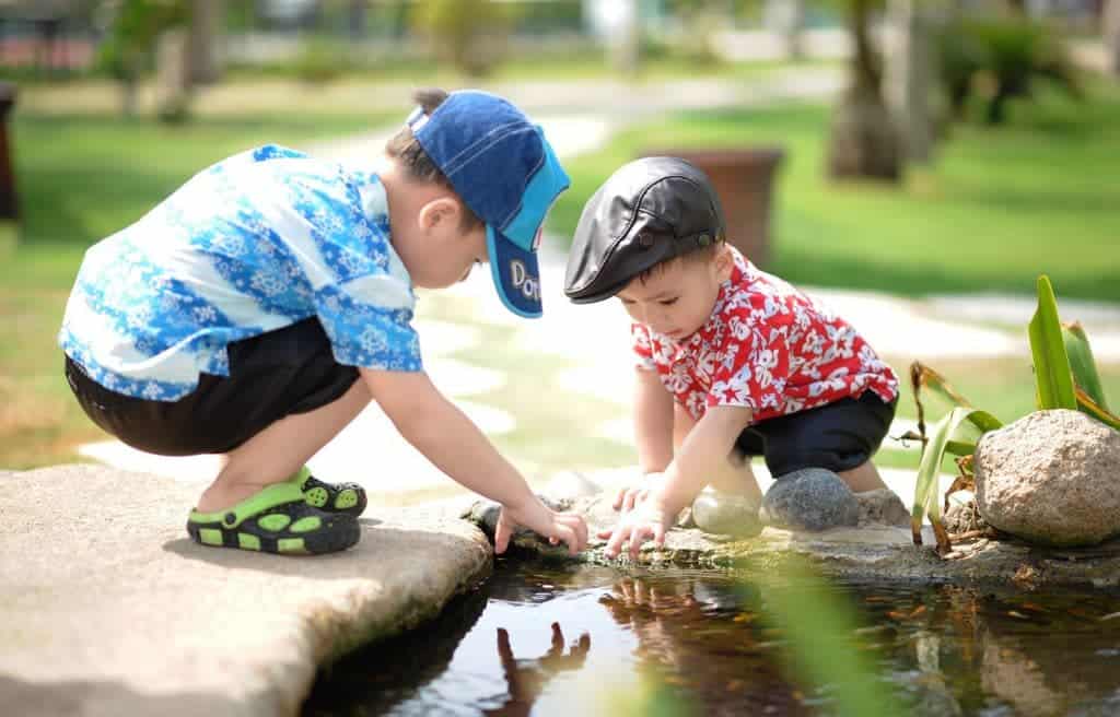 children playing on a pond