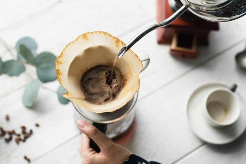 person preparing coffee
