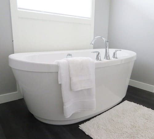 bathtub with white towel