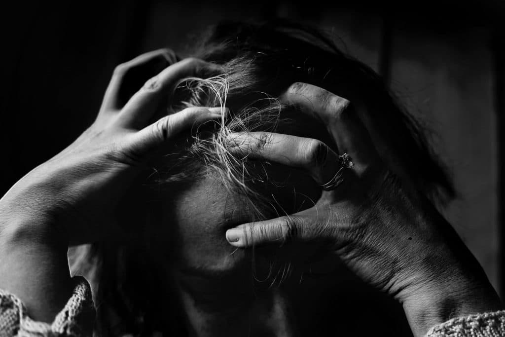 frustrated woman scratching her head