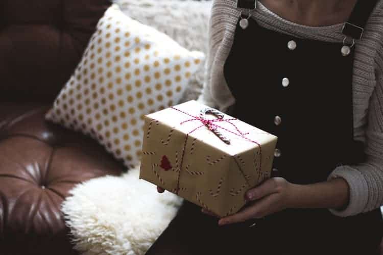 girl holding a christmas gift
