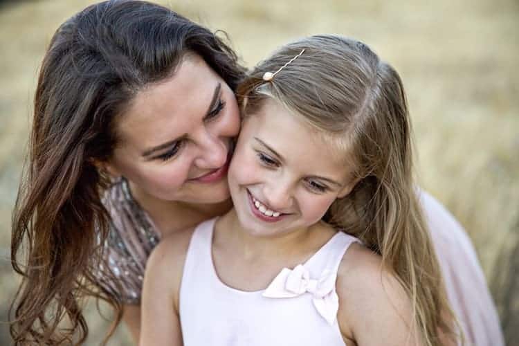 mom and her daughter happy together