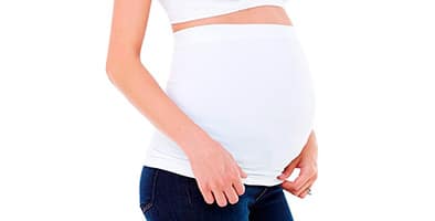 pregnant woman with belly band pulle dtight against her skin