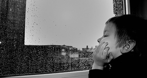 Baby watching the rain