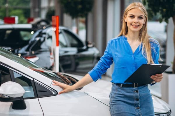 Sales woman car showroom