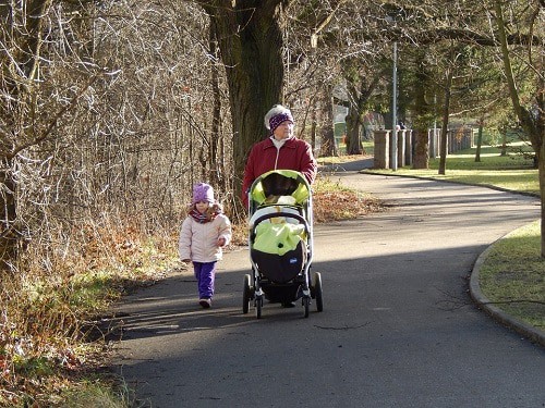 grandmother and a girl walking on the park