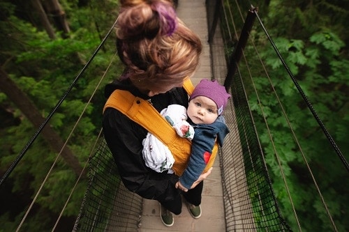 woman carrying baby