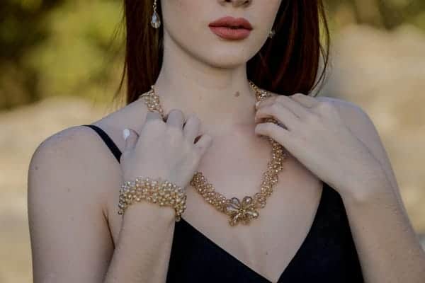 Woman Touching Necklace