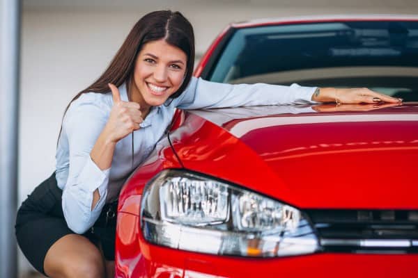 Young woman buying car