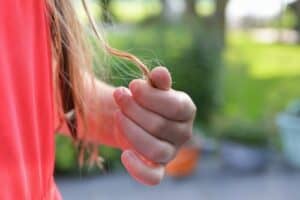 Girl curling her own hair