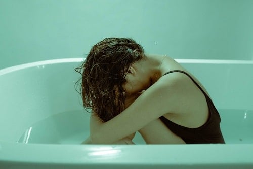Woman on a bath tub