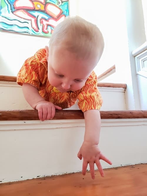 baby trying to move on stair