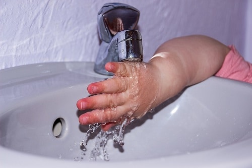 toddler washing hand