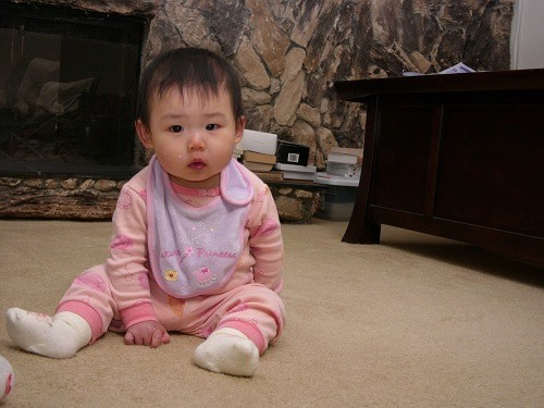baby sitting on the carpet