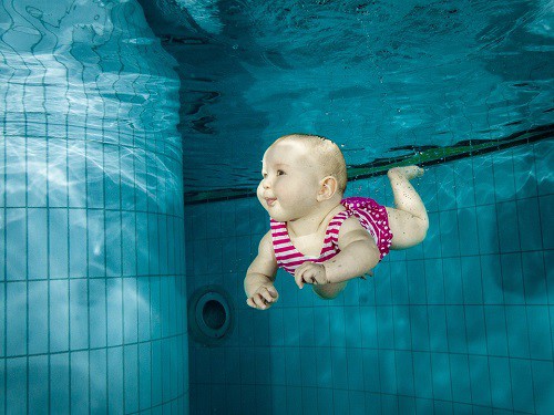 baby swimming under water