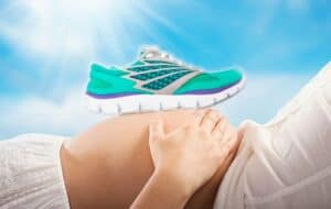 a shoe resting on a pregnant woman's stomach