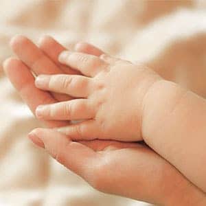 soft baby hand inside mothers