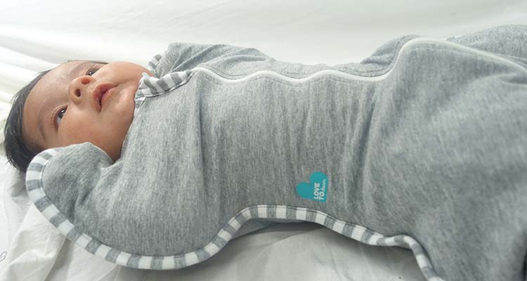baby snuggled up in love to dream swaddle up