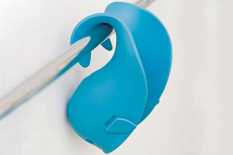 Skip Hop Moby bath Spout Cover hanging by tail on towel rail