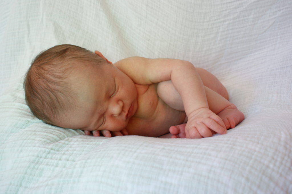 newborn photo of L