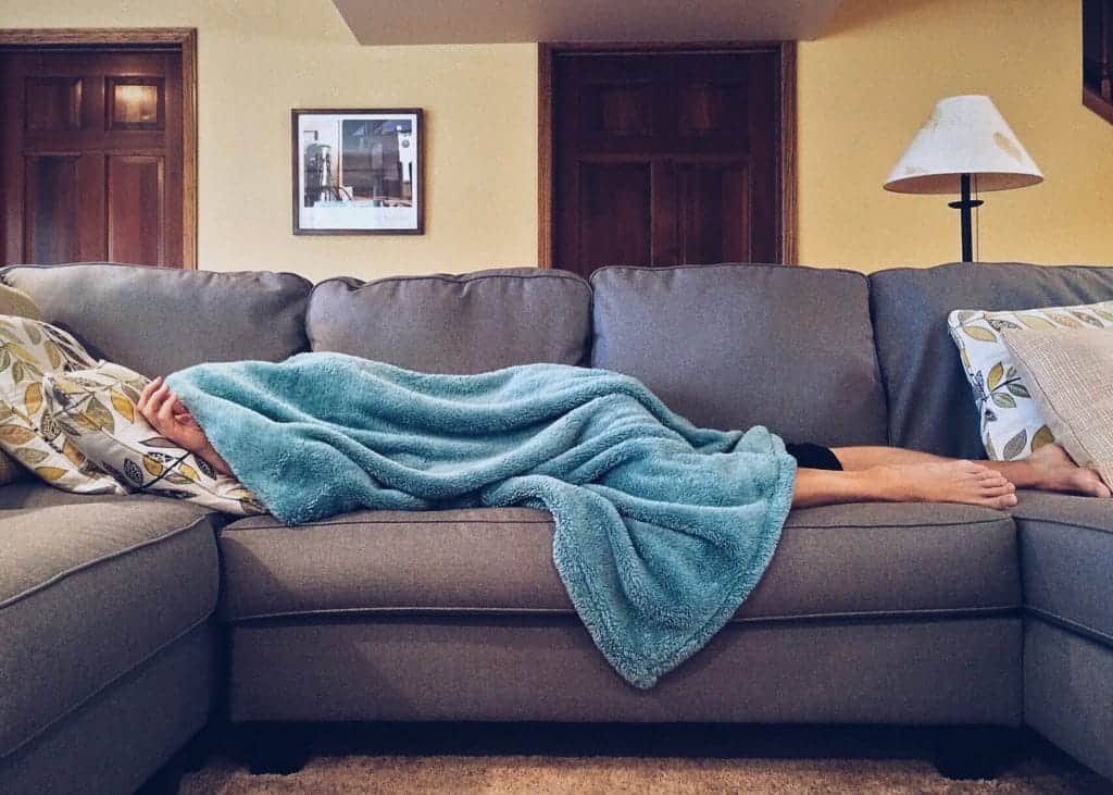 person sleeping on a sofa