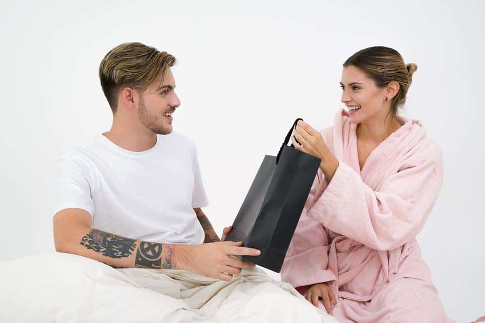 couple giving gift to one another