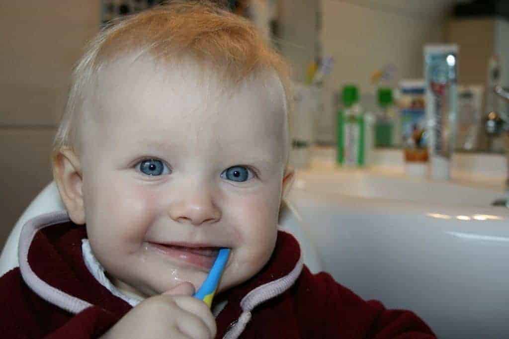 Baby toddler brushing teeth