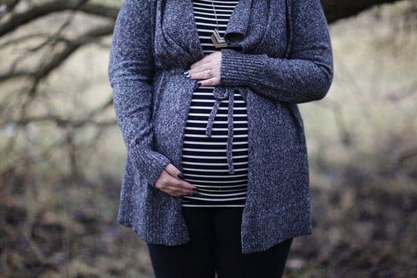 woman pregnant with stripped shirt