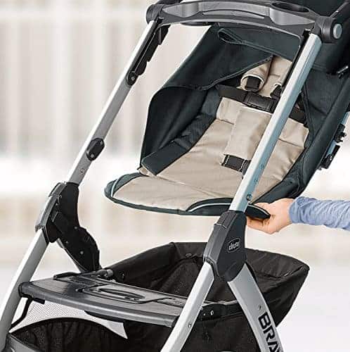 A person is installing the parts of Chicco Bravo Stroller