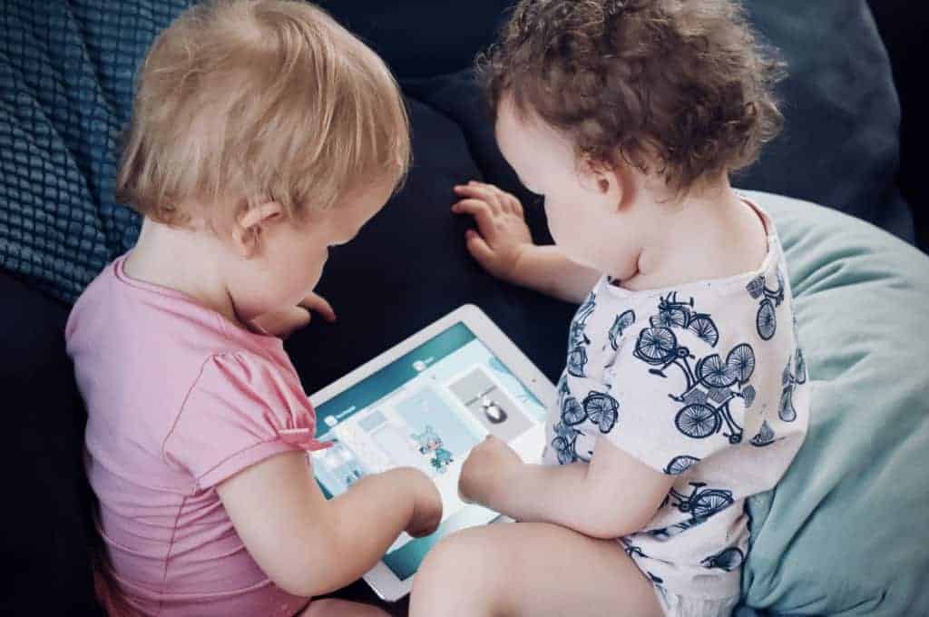 toodlers playing tablet