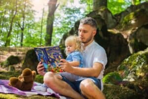man and Child Reading Book