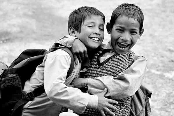 Two Boys Hugging While Laughing