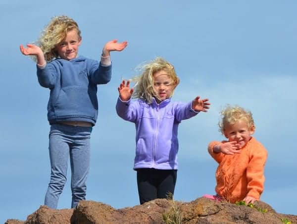 3 Kids Standing on Rock