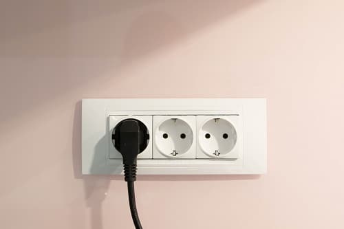 socket on the pink wall