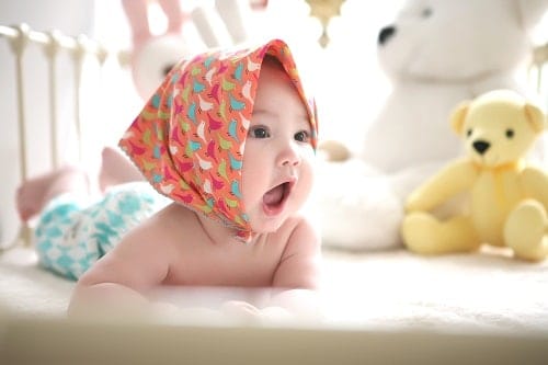 Toddler wearing head scarf