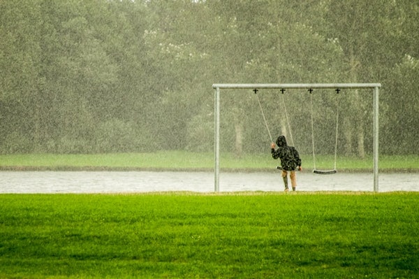 Person In Black Hoodie Riding Swing While Raining 804474