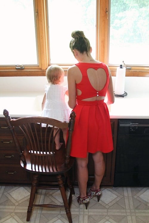 mother wearing red dress and daughter