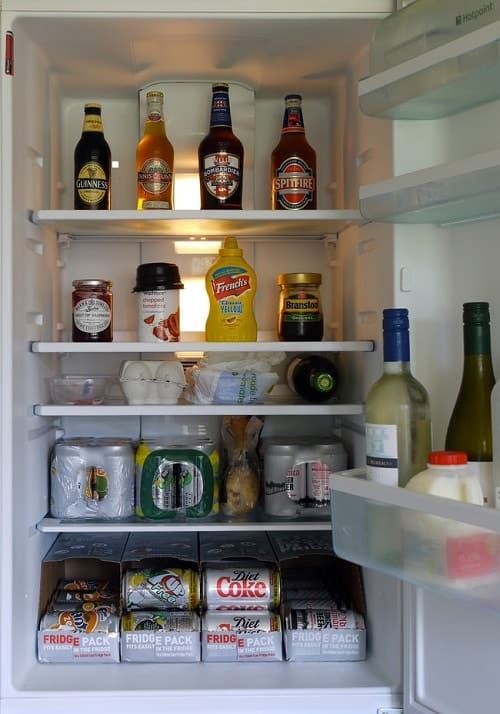 refrigerator full of soda and beer