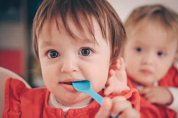 Toddler Putting Spoon In Mouth