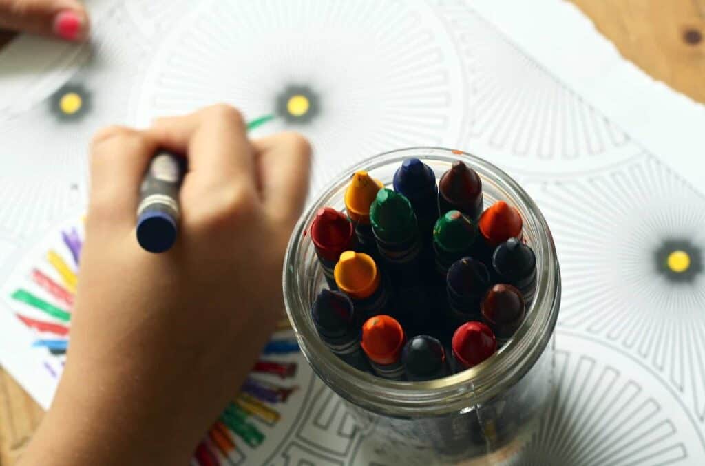 A child colors to ease cabin fever