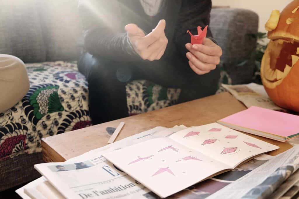 Teenagers with cabin fever learn origami